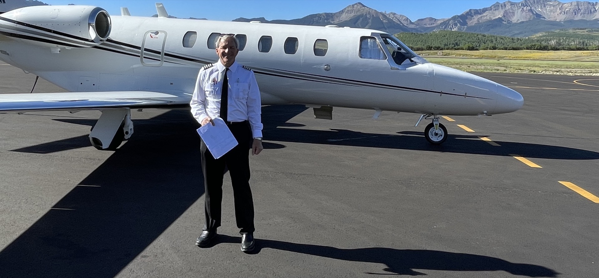 Citation jet against mountain backdrop
